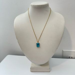 the giving keys blue emerald cut gemstone gold necklace